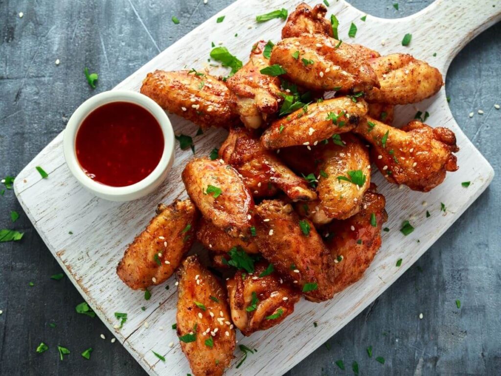 freshly cooked chicken wings with dipping sauce