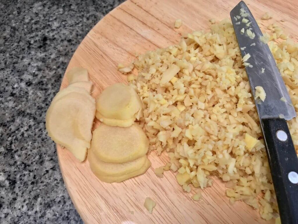 freshly minced ginger on a cutting board