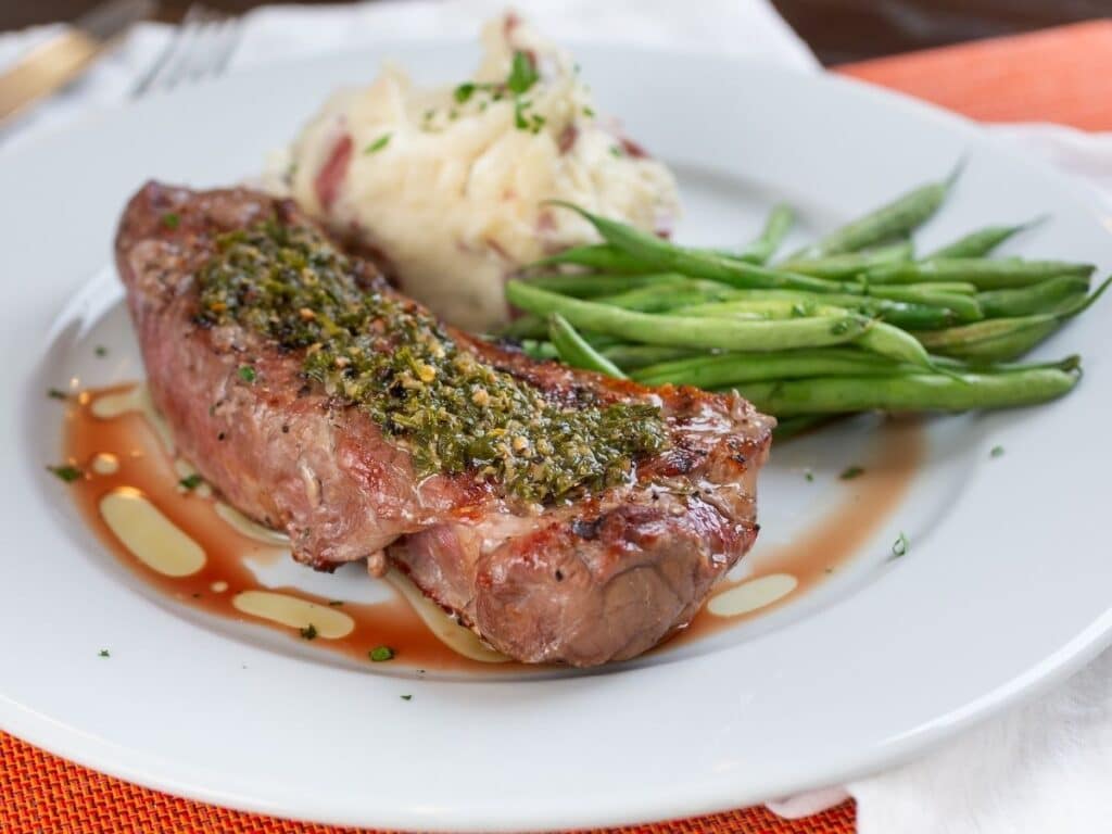 plate of beef and green beans with gravy