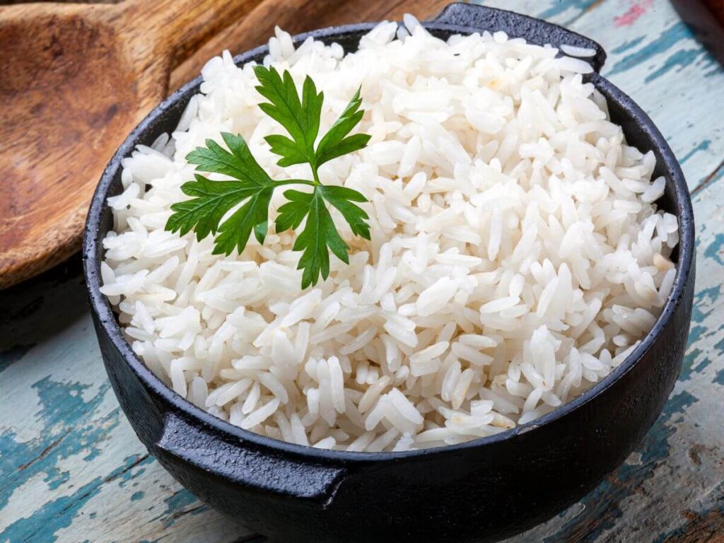 bowl of white rice with herbs