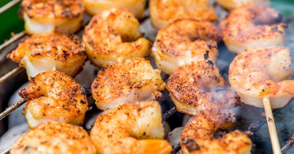 Frozen Shrimp being cooked on a grill