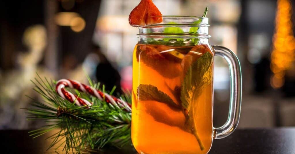 glass of Peppermint Tea with a candy cane