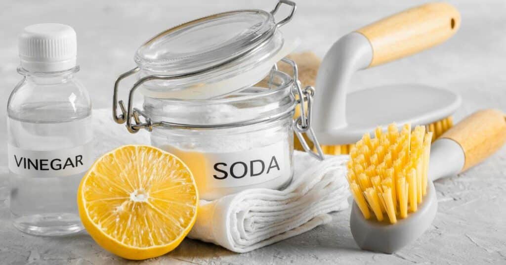 containers of Baking Soda And Vinegar to clean the drain
