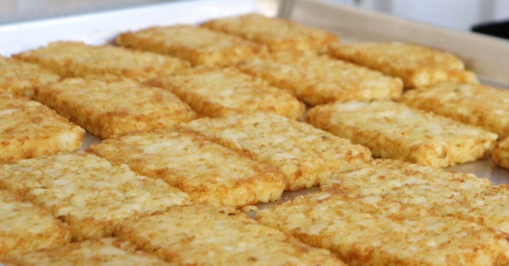 Frozen Hash Browns cooking in an oven