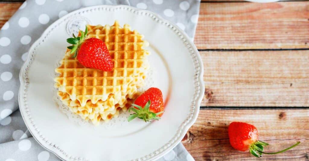 a plate of crispy waffles made with pancake mix