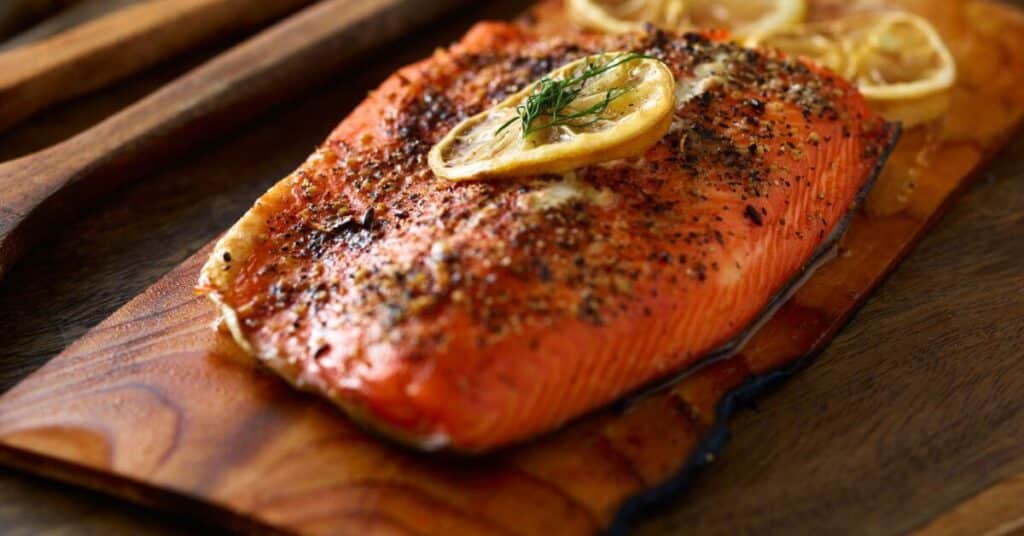 salmon with lemon cooked on a cedar plank