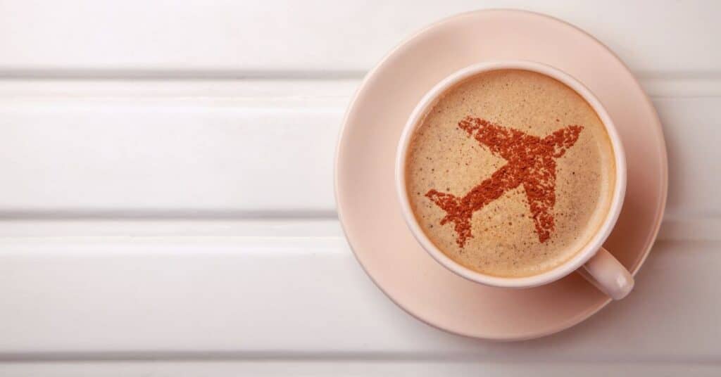 cup of coffee with an airplane in the foam