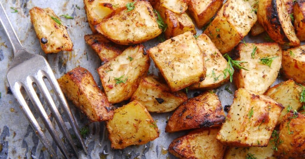 roasted potatoes with fork