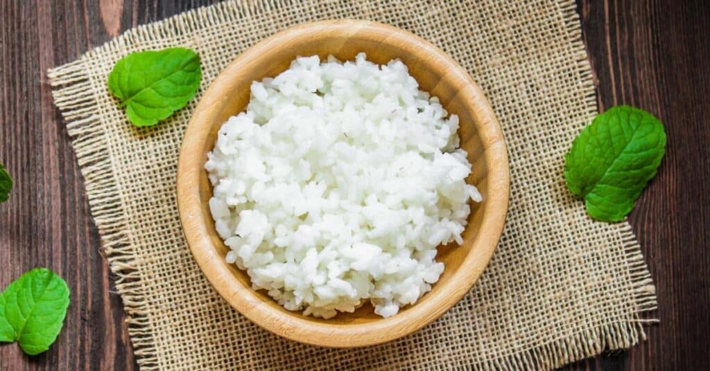bowl of white rice with fresh bay leaf