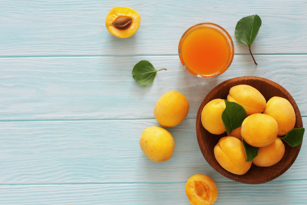 bowl of apricots and a glass of apricot nectar