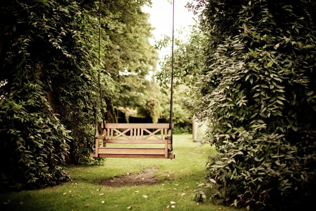 Hanging swing in outdoor garden