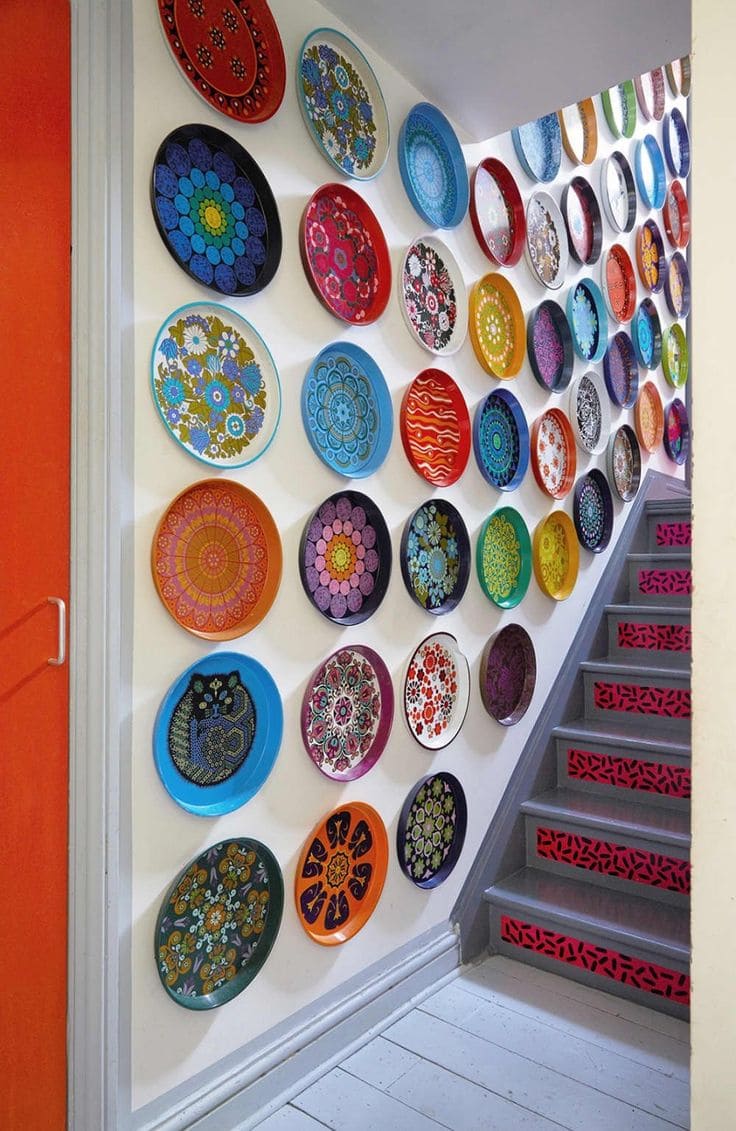 Whimsical Painted Plate Stairway Gallery Wall