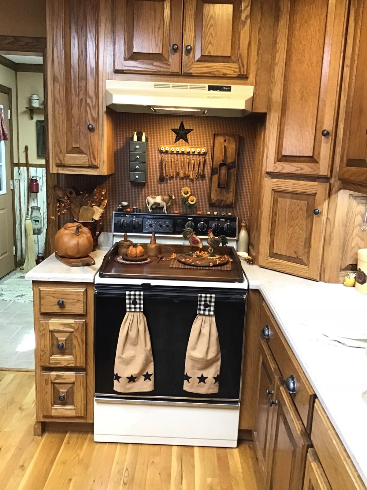 Cozy Farmhouse Stove Corner with Autumn Decor