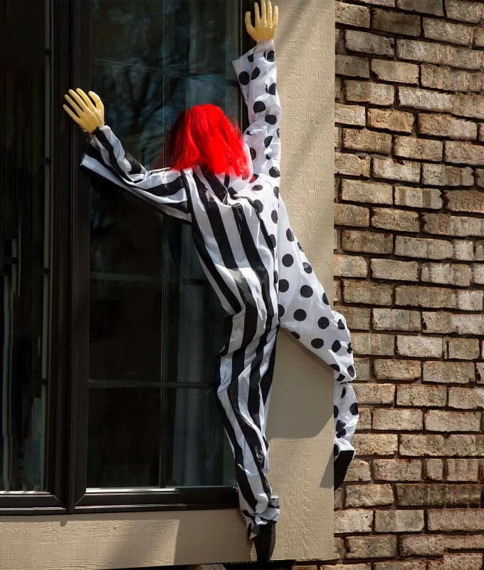 Creepy Climbing Clown Window Display