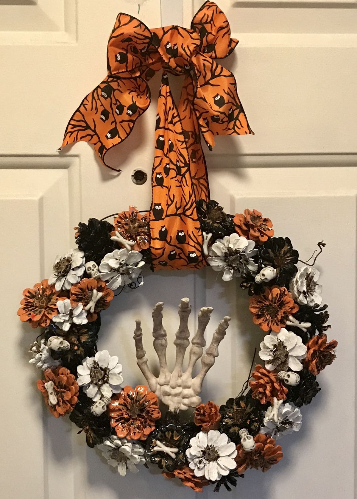 Skeleton Hand Pinecone Wreath
