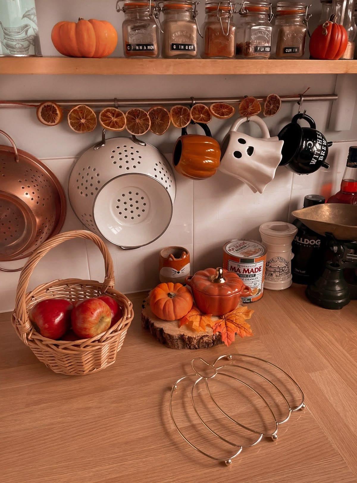Whimsical Autumn Nook with Halloween Mugs and Cozy Counter Decor