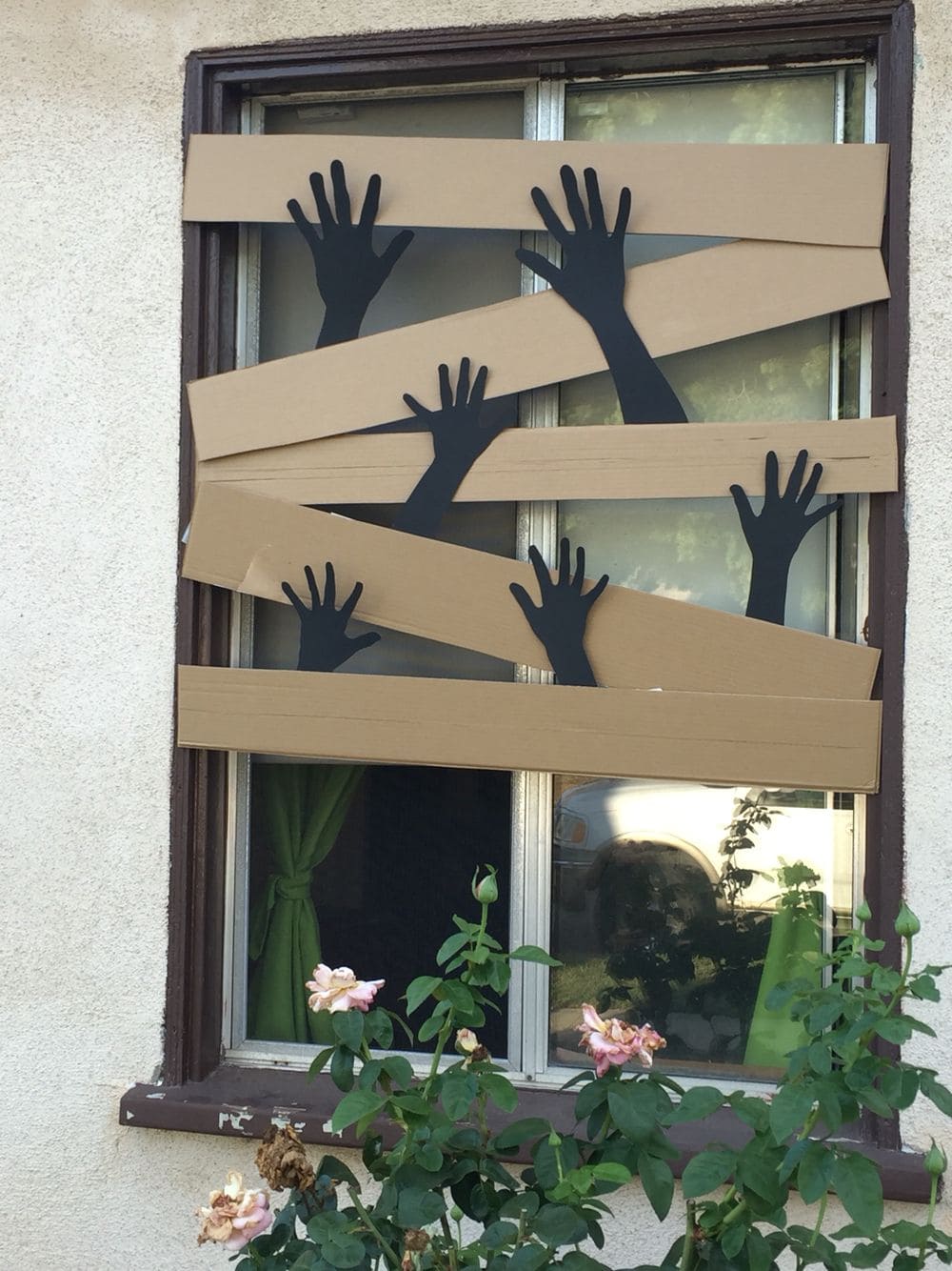 Zombie Hands Breaking Through Window